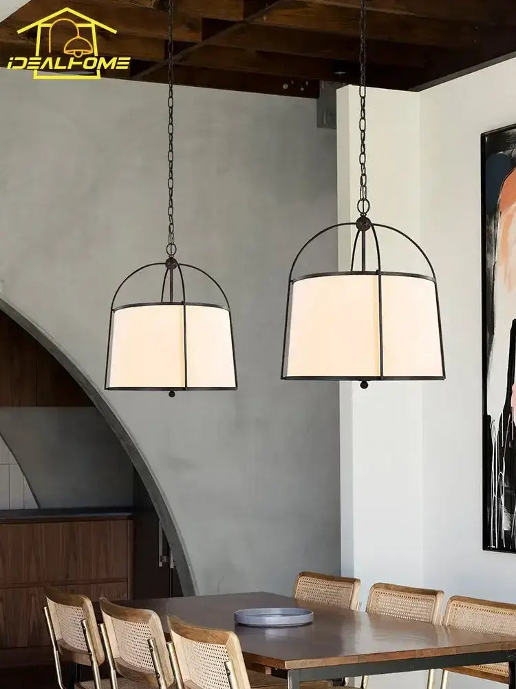 Modern gold & black pendant lights with fabric shades dining room