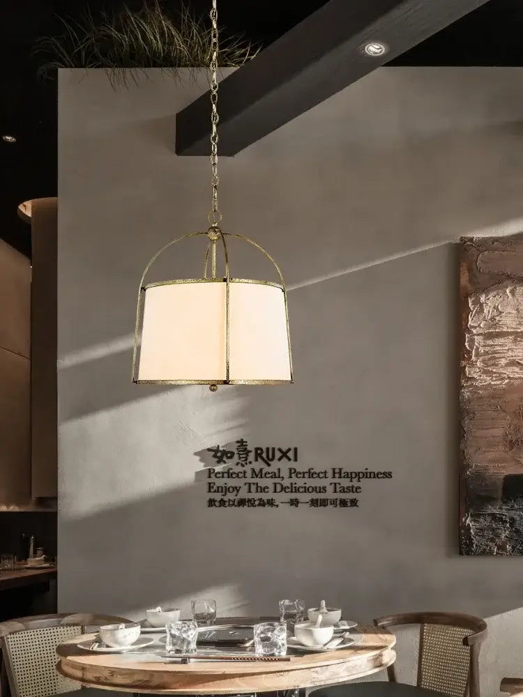 Modern gold & black pendant lights with fabric shades dining room
