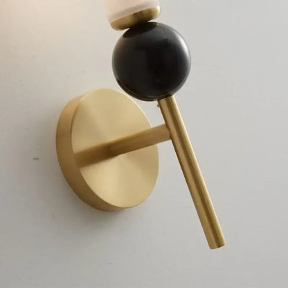 Modern gold & black wall lamp with glass shade living room decor