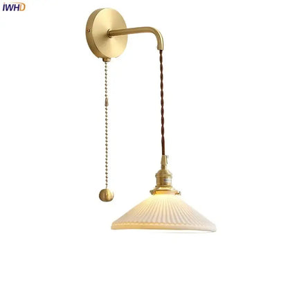 Modern gold ceramic wall lamp with ribbed shade for bedroom