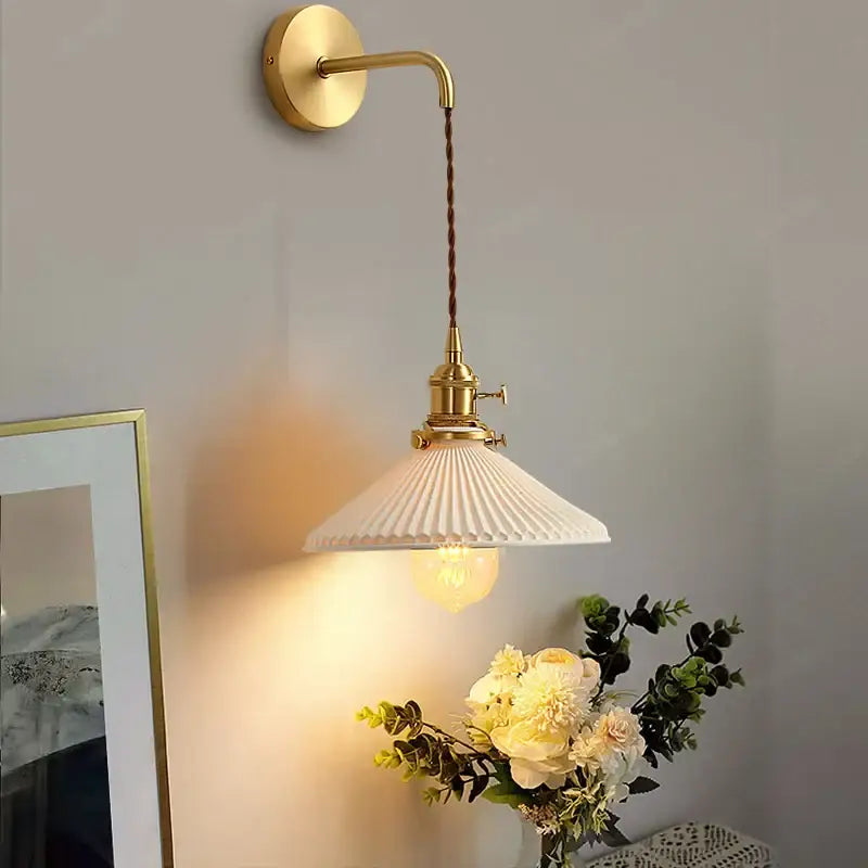 Modern gold ceramic wall lamp with ribbed shade for bedroom