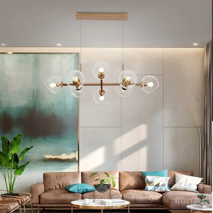 Modern gold chandelier with clear glass globes for dining room