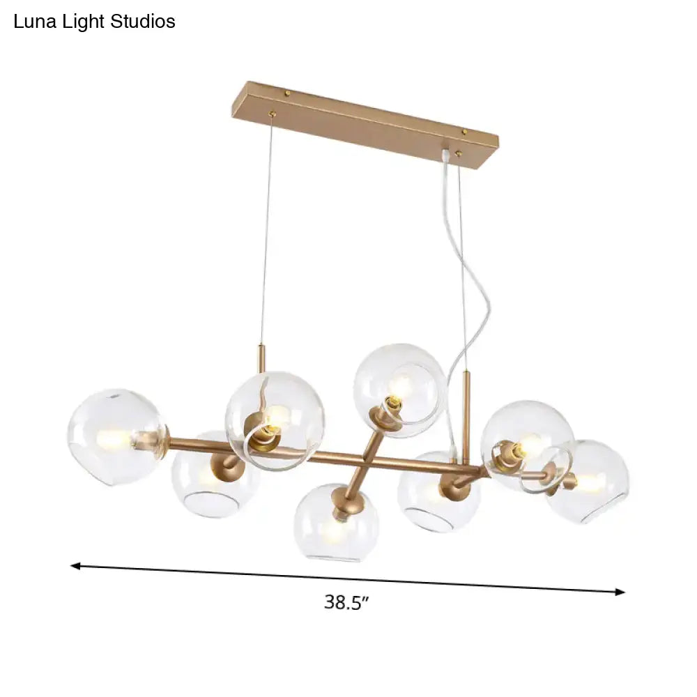 Modern gold chandelier with clear glass globes for dining room