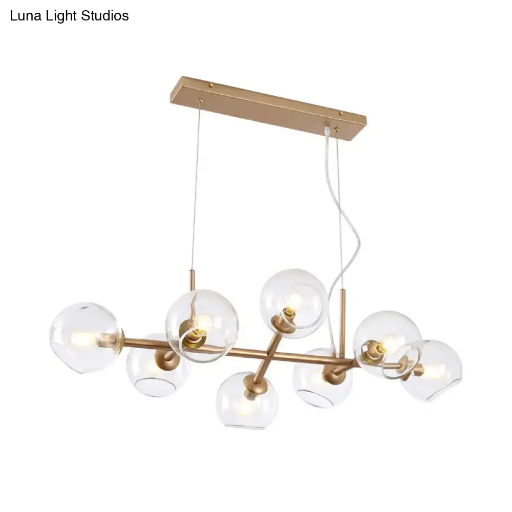 Modern gold chandelier with clear glass globes for dining room