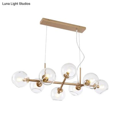 Modern gold chandelier with clear glass globes for dining room