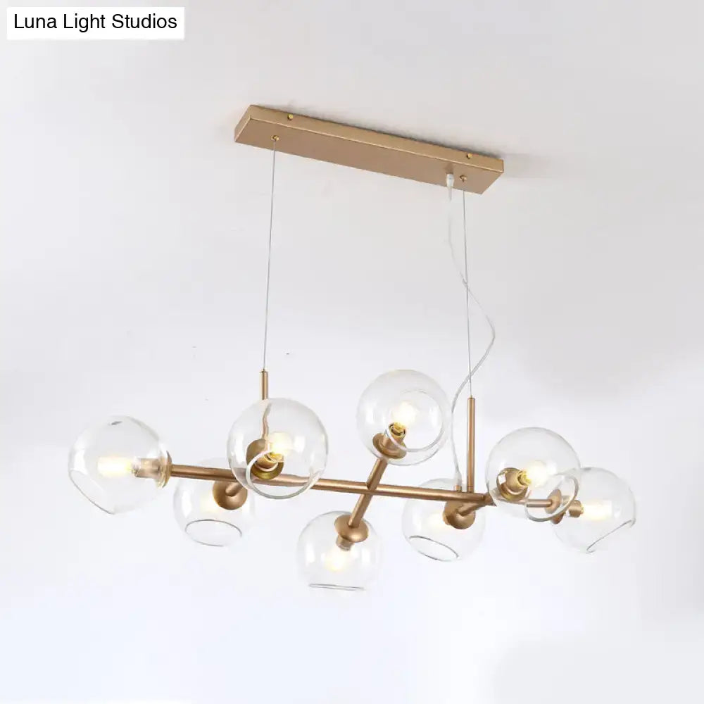 Modern gold chandelier with clear glass globes for dining room