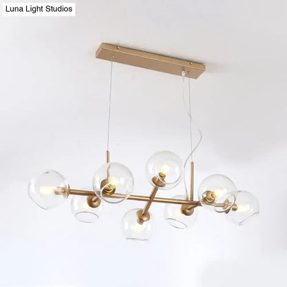 Modern gold chandelier with clear glass globes for dining room