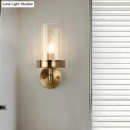 Modern gold finish wall light with glass shade – bedroom sconce