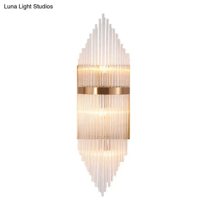 Modern gold geometric wall sconce with clear glass for living room