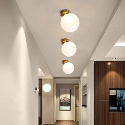 Modern gold glass ball wall lamp for bedroom with frosted globe