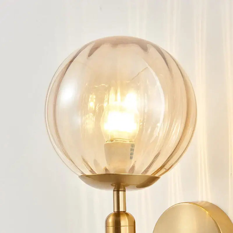 Modern gold iron led sconce lamp with textured glass for bedroom