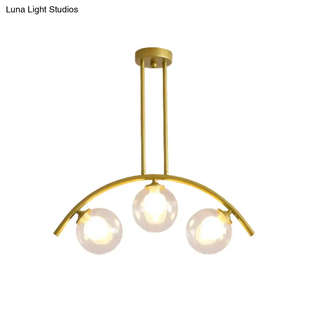 Modern gold island pendant with clear white shade for kitchens