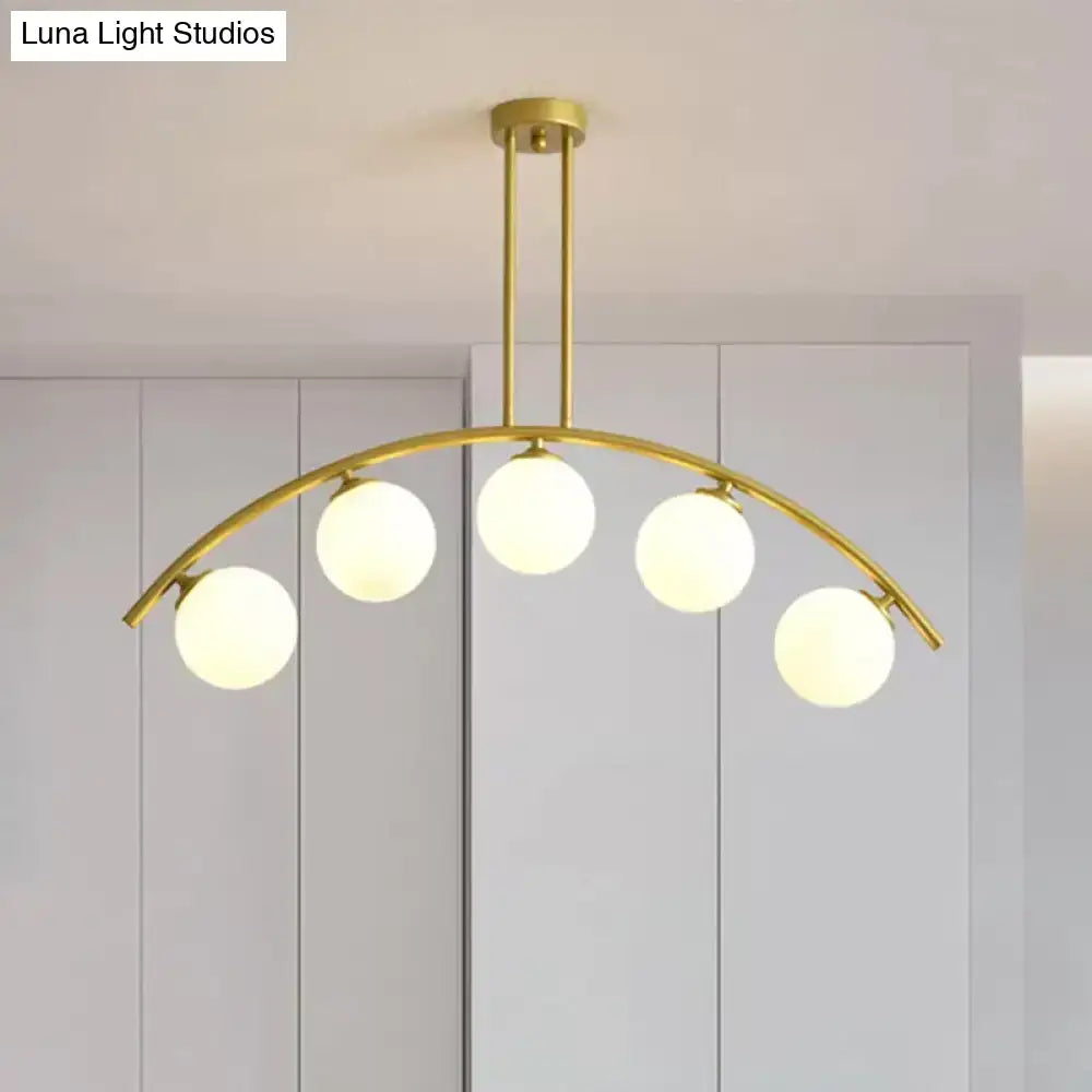 Modern gold island pendant with clear white shade for kitchens