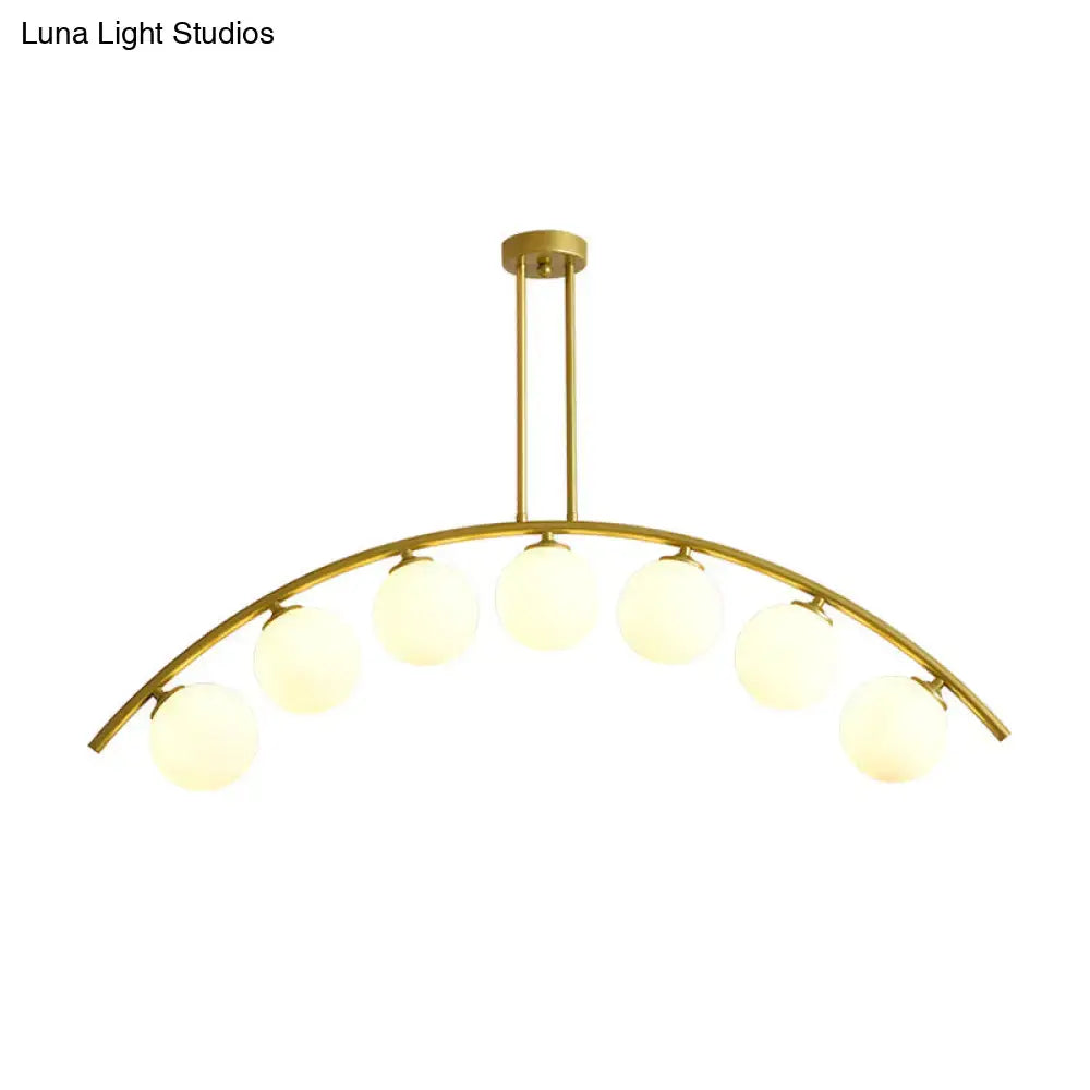 Modern gold island pendant with clear white shade for kitchens