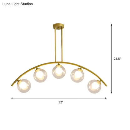 Modern gold island pendant with clear white shade for kitchens