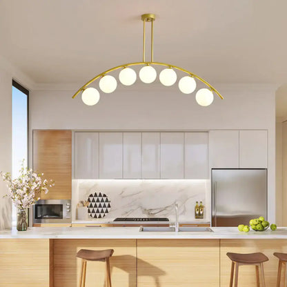 Modern gold island pendant with clear white shade for kitchens