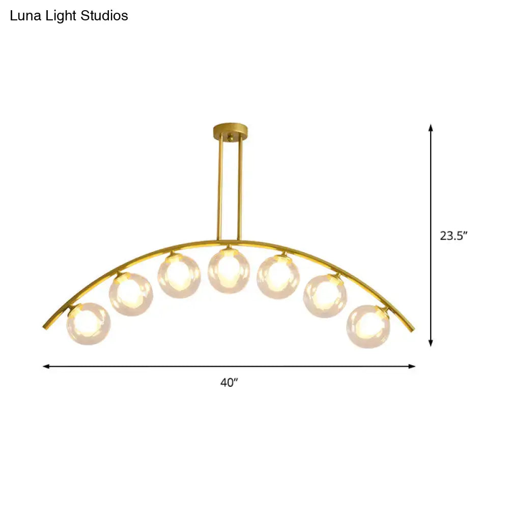 Modern gold island pendant with clear white shade for kitchens