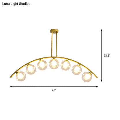 Modern gold island pendant with clear white shade for kitchens