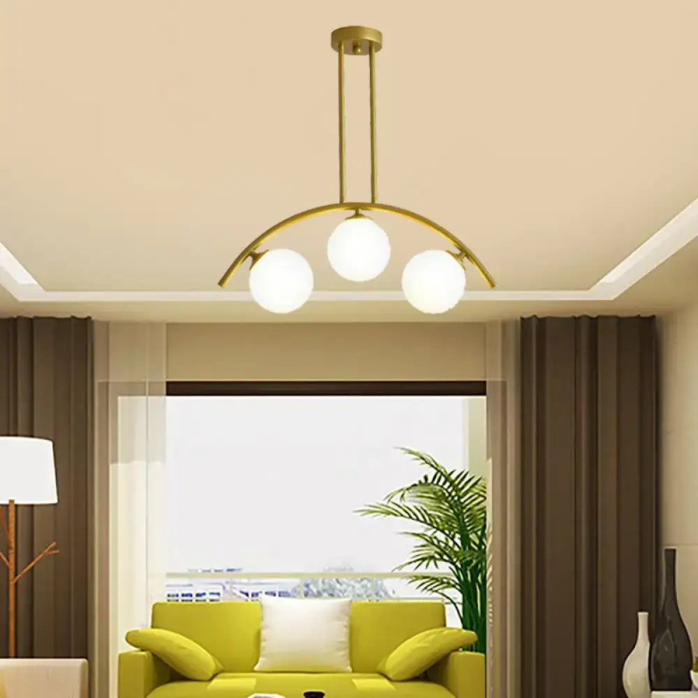 Modern gold island pendant with clear white shade for kitchens