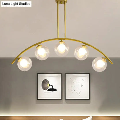 Modern gold island pendant with clear white shade for kitchens