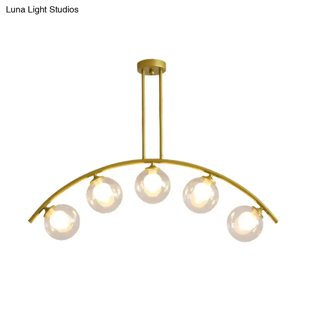 Modern gold island pendant with clear white shade for kitchens