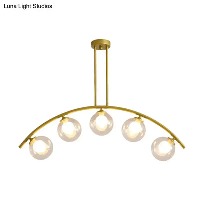 Modern gold island pendant with clear white shade for kitchens