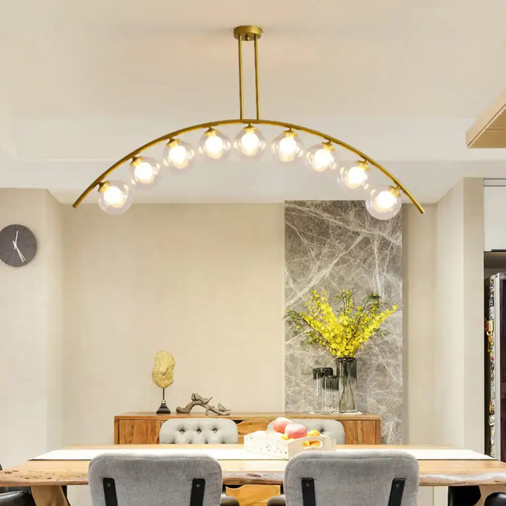 Modern gold island pendant with clear white shade for kitchens