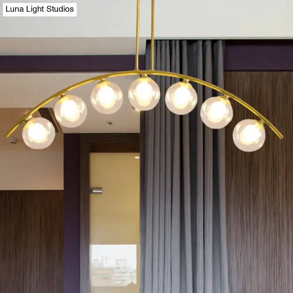 Modern gold island pendant with clear white shade for kitchens