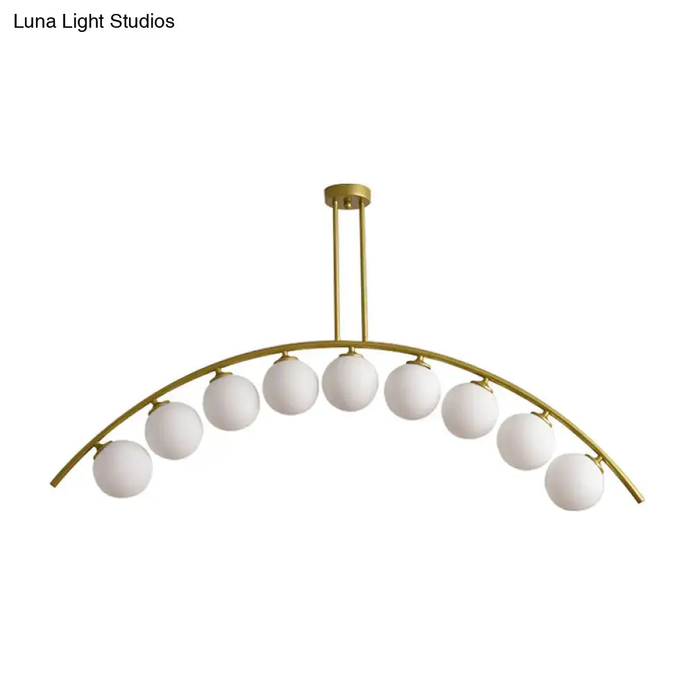 Modern gold island pendant with clear white shade for kitchens