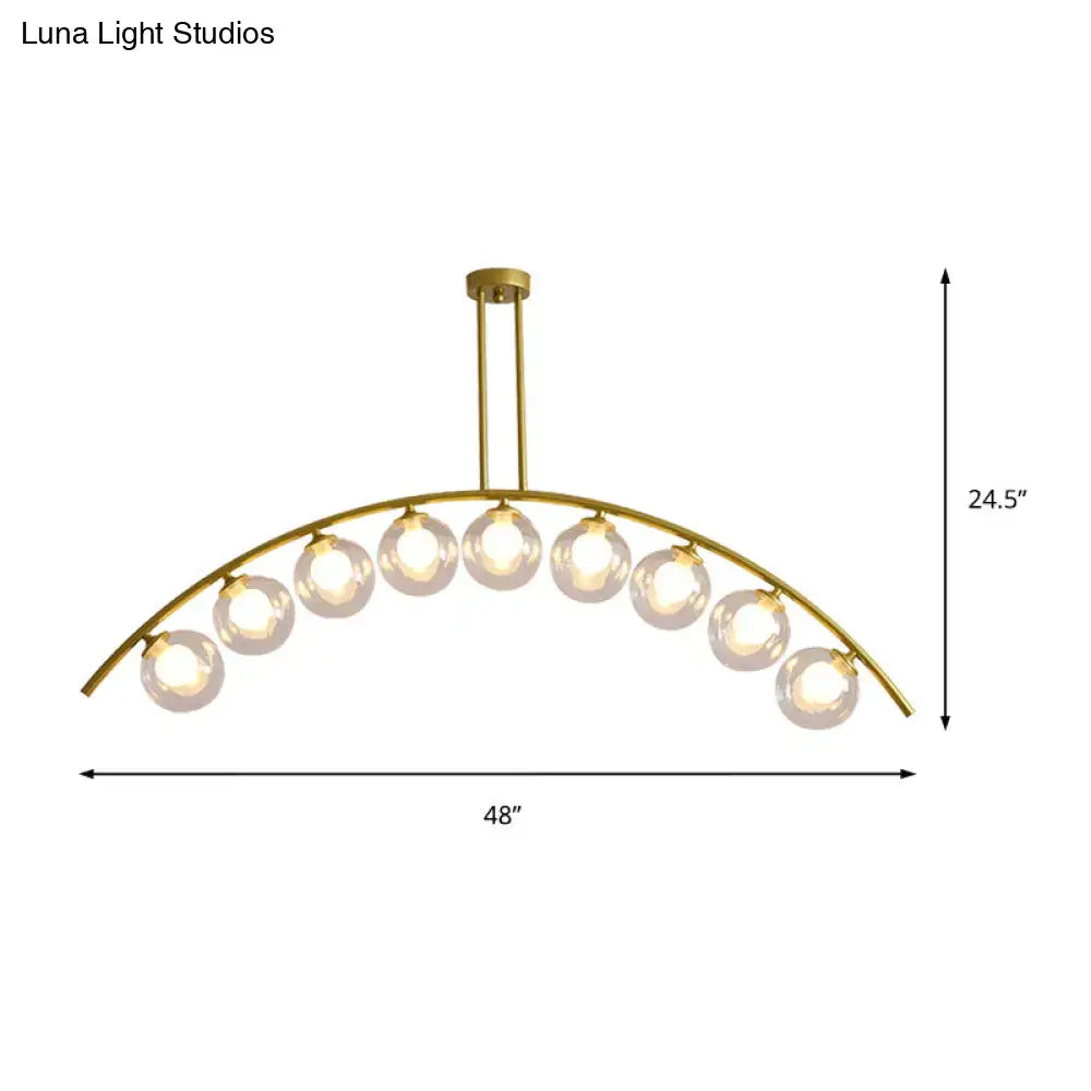Modern gold island pendant with clear white shade for kitchens