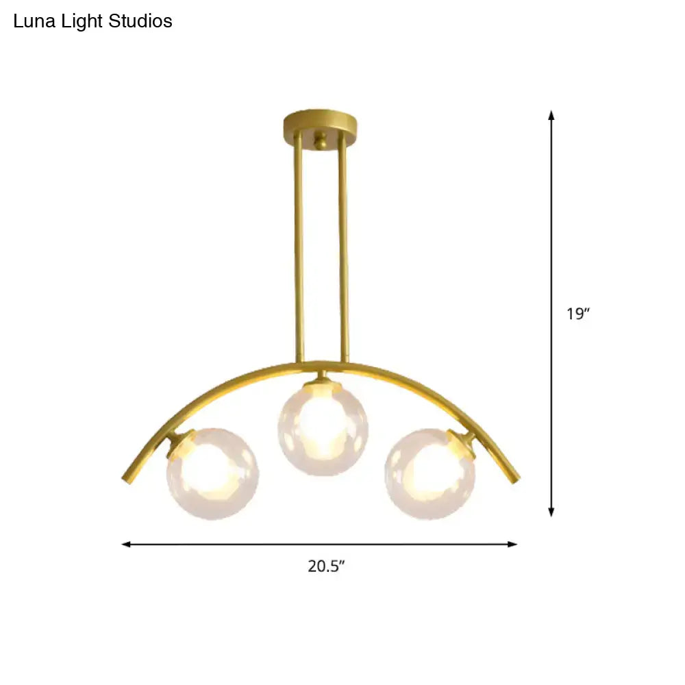 Modern gold island pendant with clear white shade for kitchens