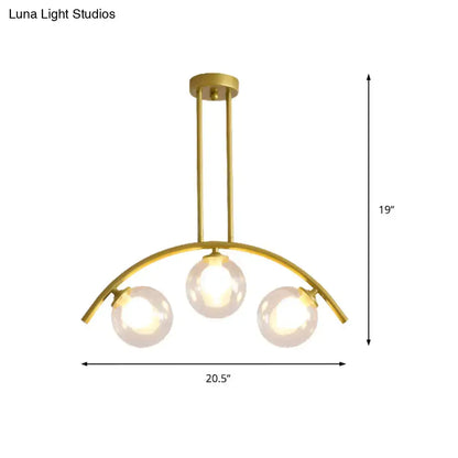 Modern gold island pendant with clear white shade for kitchens