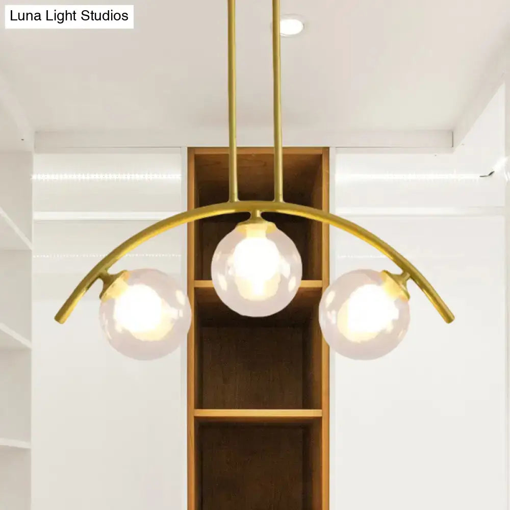 Modern gold island pendant with clear white shade for kitchens