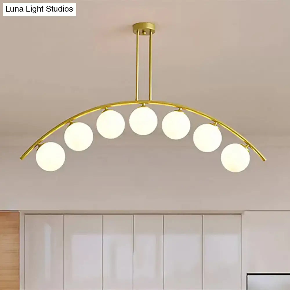 Modern gold island pendant with clear white shade for kitchens