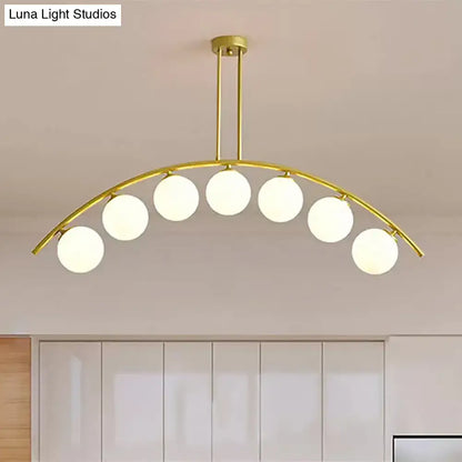 Modern gold island pendant with clear white shade for kitchens