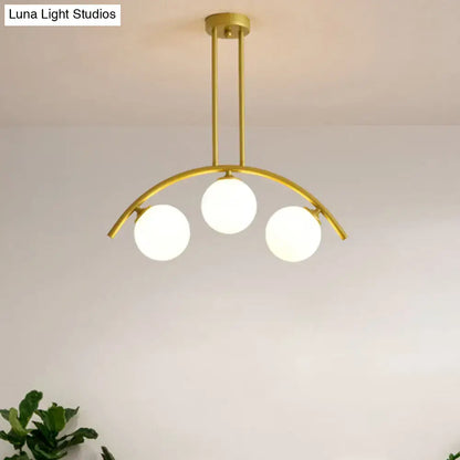 Modern gold island pendant with clear white shade for kitchens