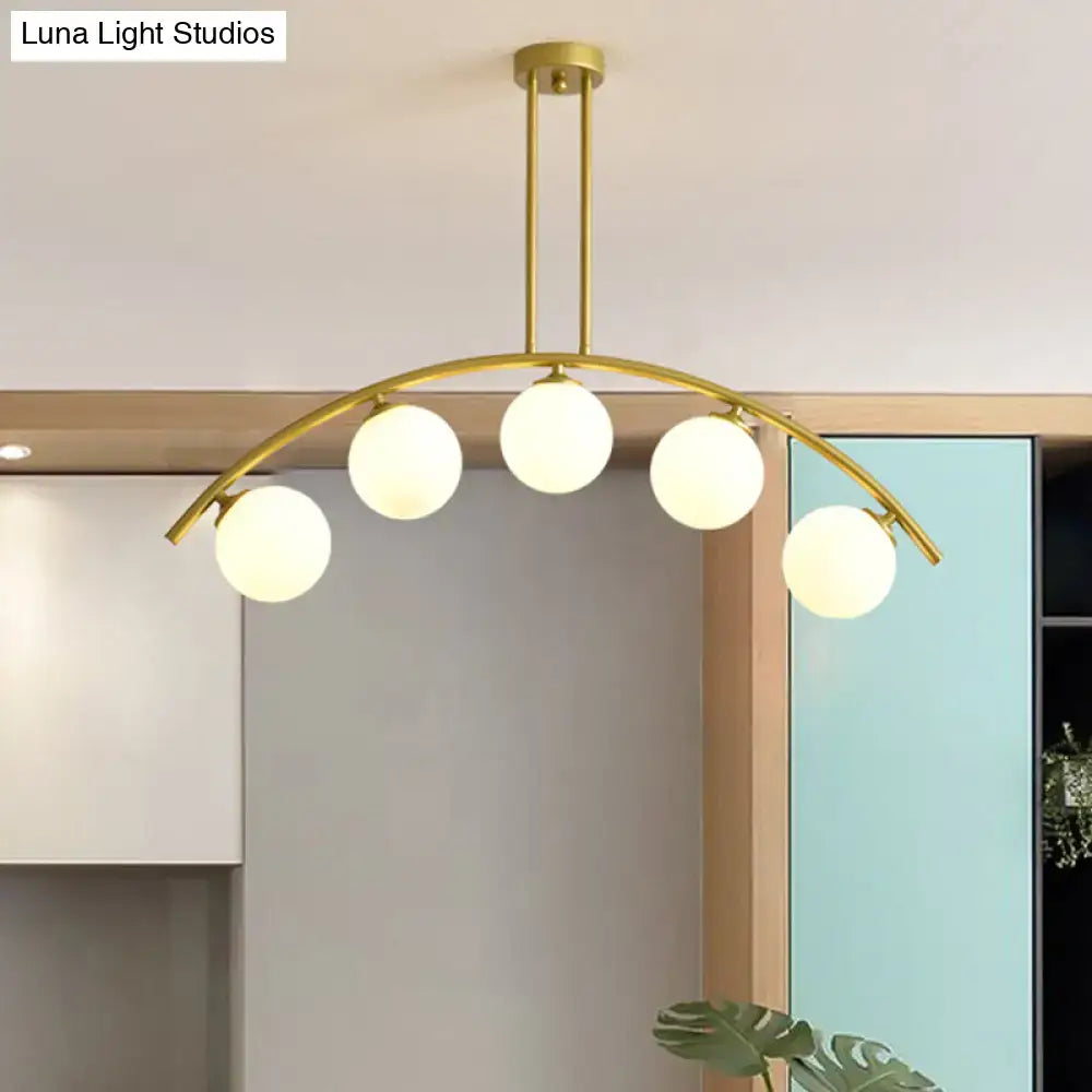 Modern gold island pendant with clear white shade for kitchens