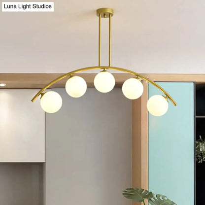 Modern gold island pendant with clear white shade for kitchens