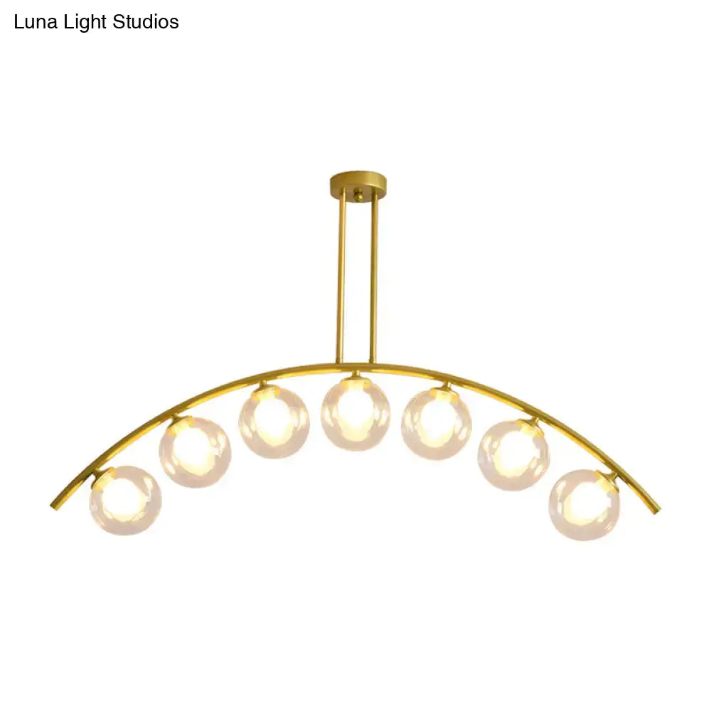 Modern gold island pendant with clear white shade for kitchens