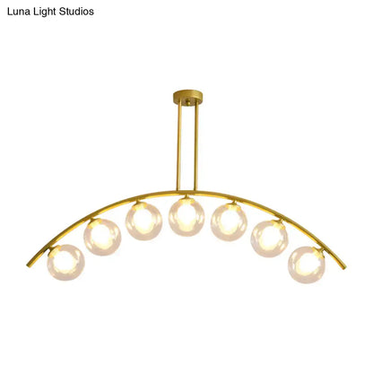 Modern gold island pendant with clear white shade for kitchens