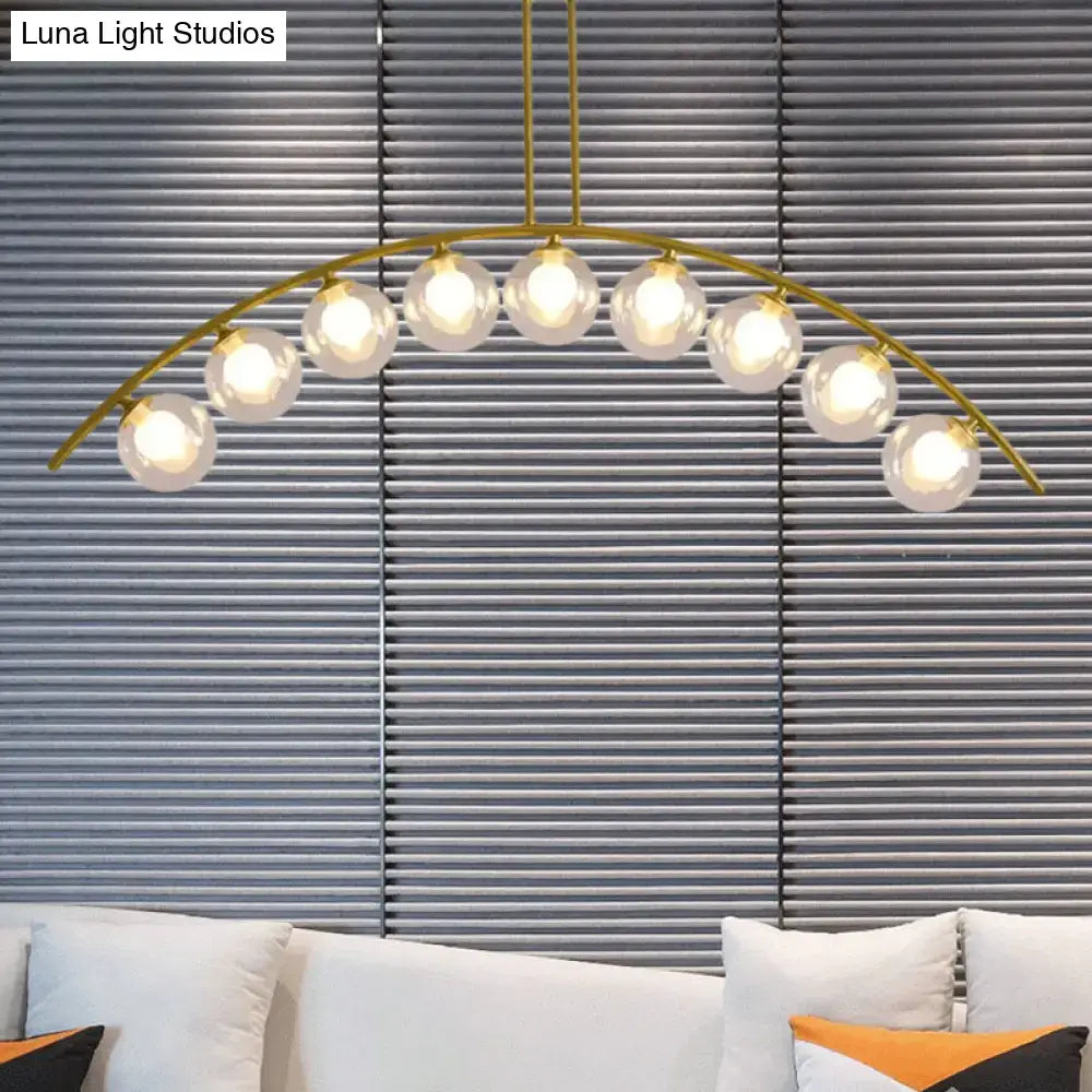 Modern gold island pendant with clear white shade for kitchens