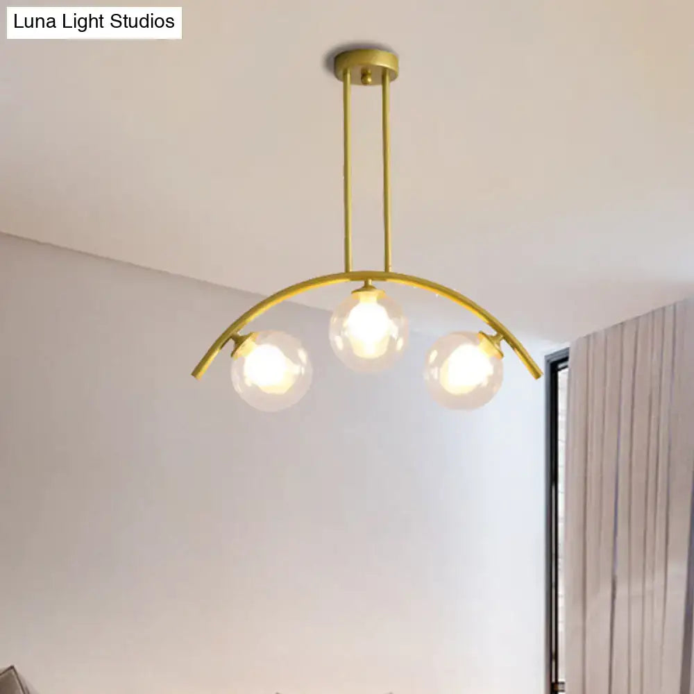 Modern gold island pendant with clear white shade for kitchens