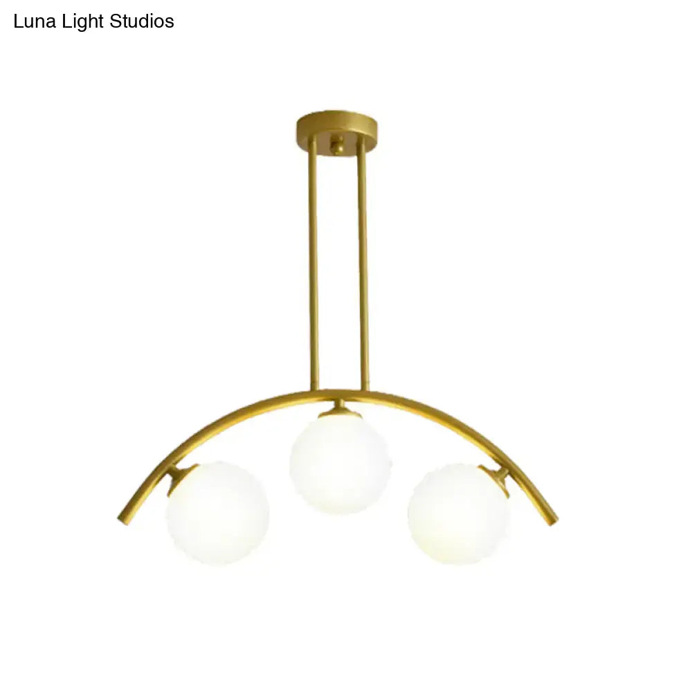 Modern gold island pendant with clear white shade for kitchens