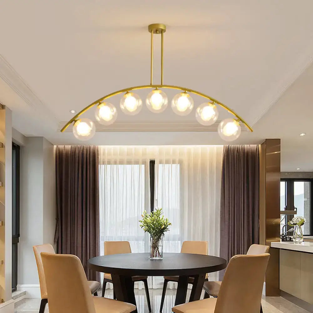 Modern gold island pendant with clear white shade for kitchens