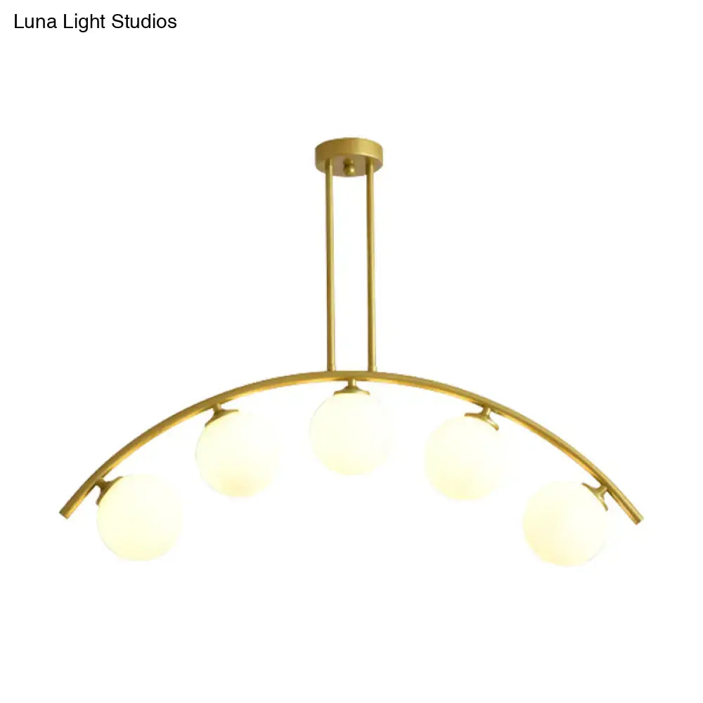 Modern gold island pendant with clear white shade for kitchens