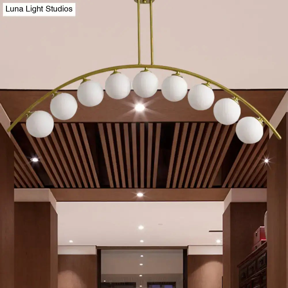 Modern gold island pendant with clear white shade for kitchens