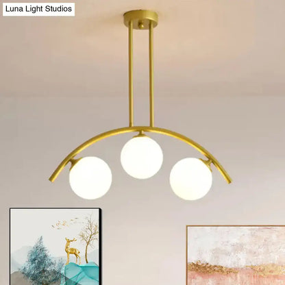 Modern gold island pendant with clear white shade for kitchens