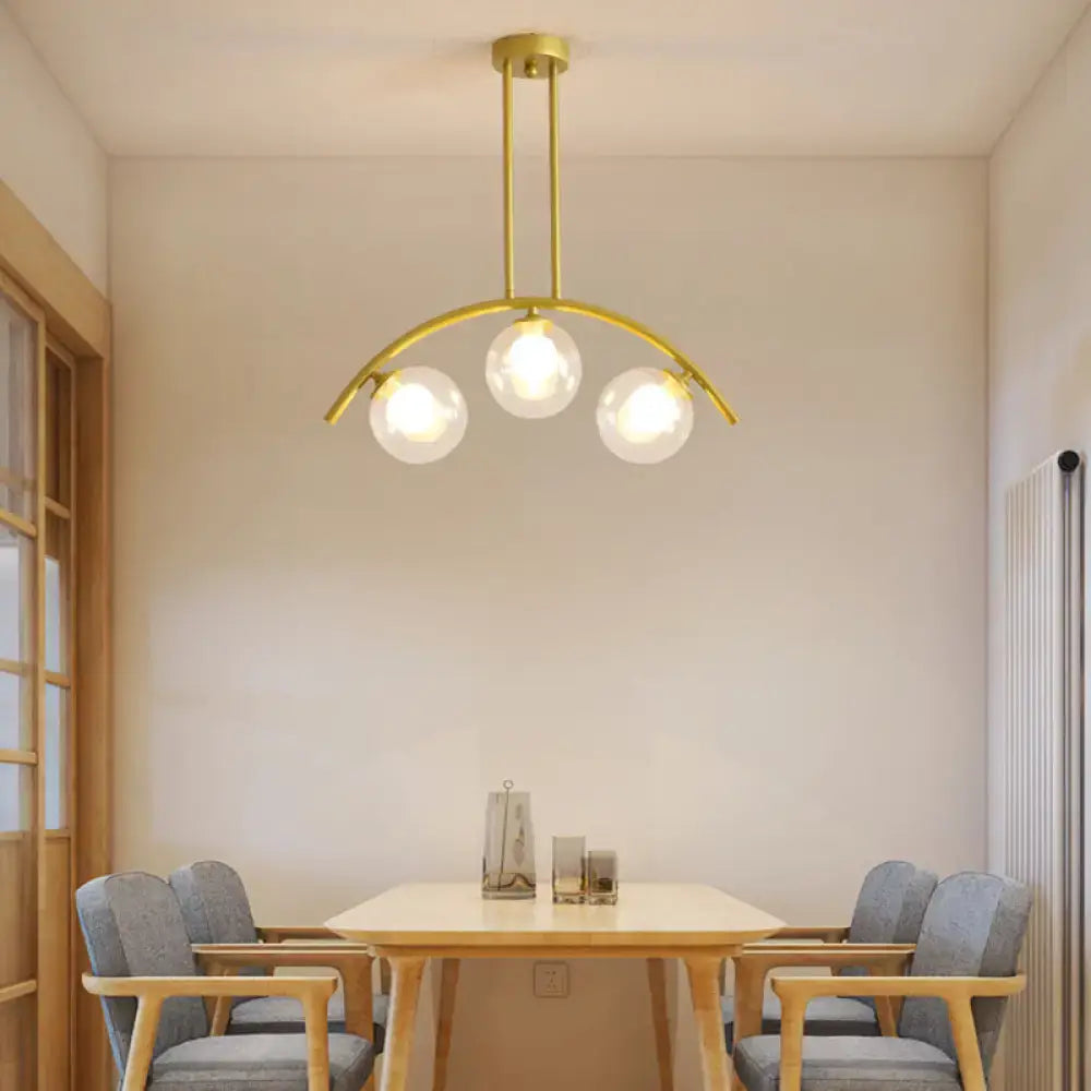 Modern gold island pendant with clear white shade for kitchens