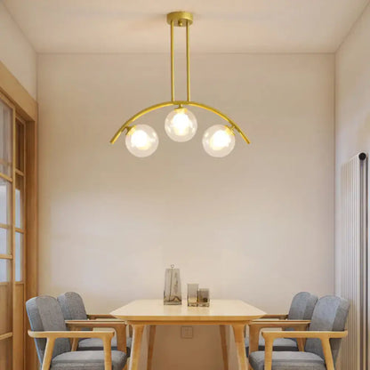 Modern gold island pendant with clear white shade for kitchens