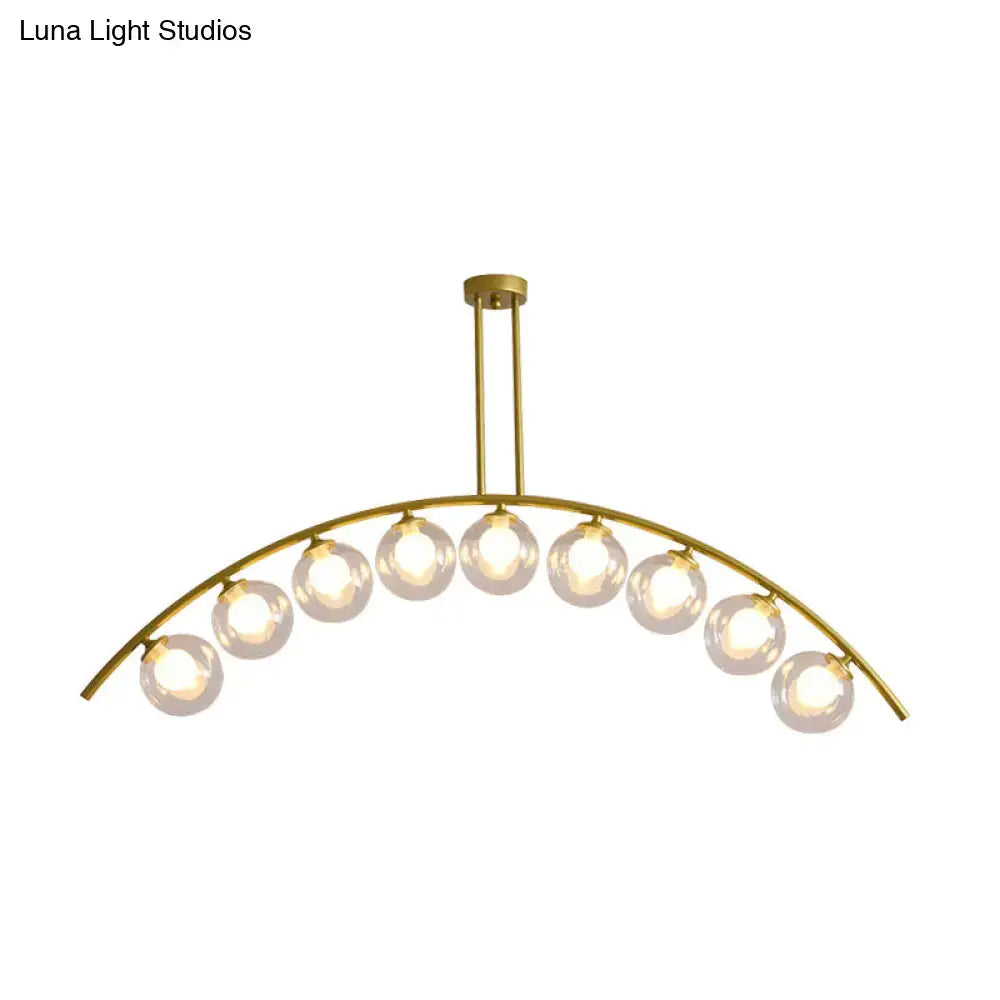 Modern gold island pendant with clear white shade for kitchens